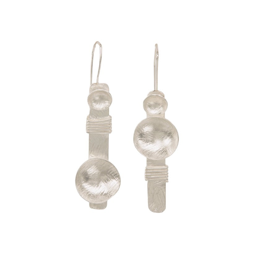 Silver plated hammered disc dangle earrings, front view on neutral background