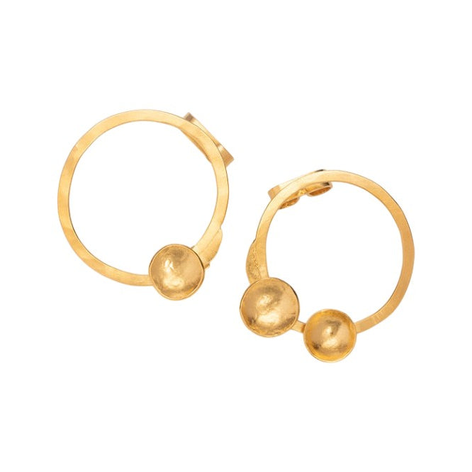 Pair of sculptural minimalist hoop earrings in gold on white background