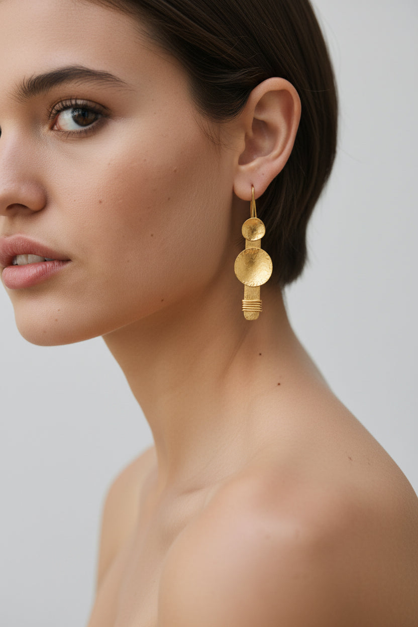 Model wearing gold plated hammered earrings, minimalist styling