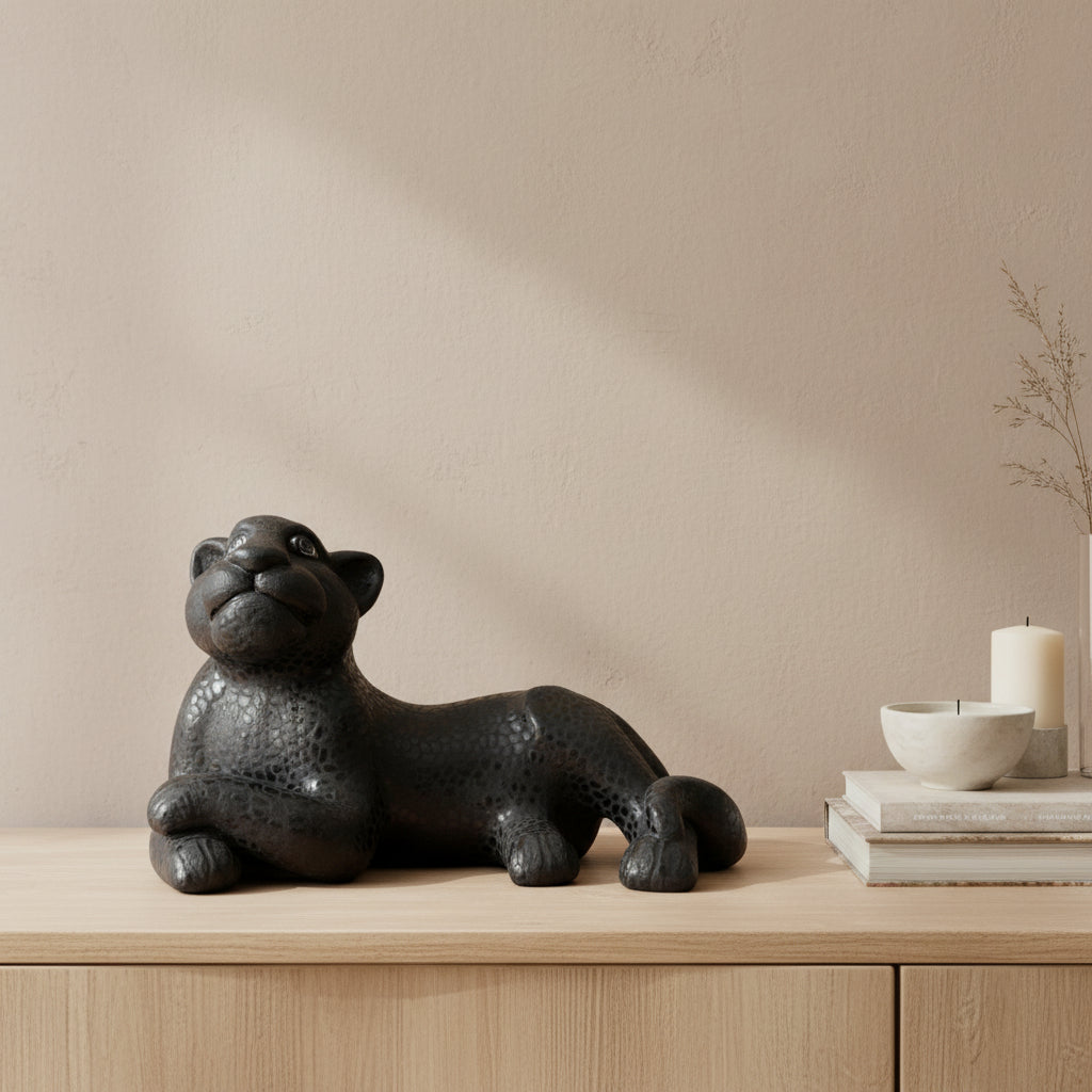 Black hand-painted Mayan jaguar sculpture on wooden console table with minimalist decor
