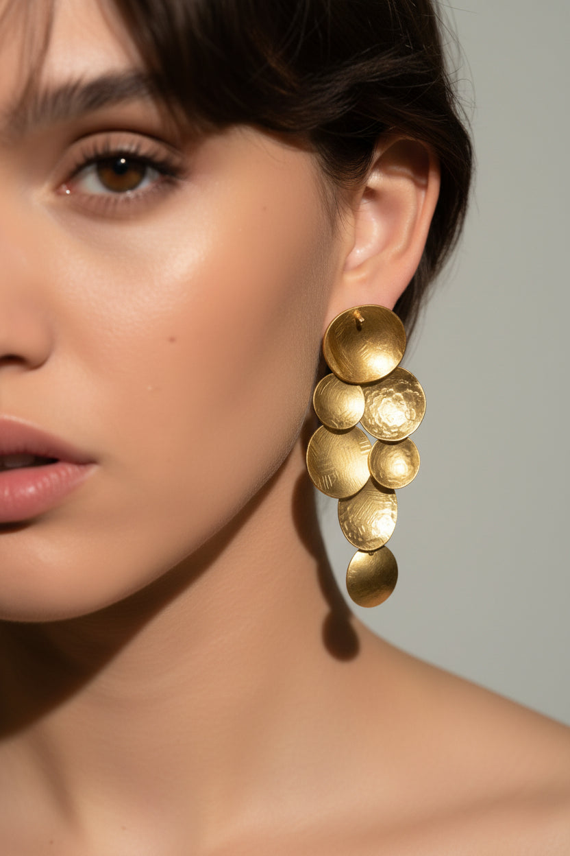 Cascade Sphere Earrings gold plated, close-up portrait showing cascading hammered sphere design