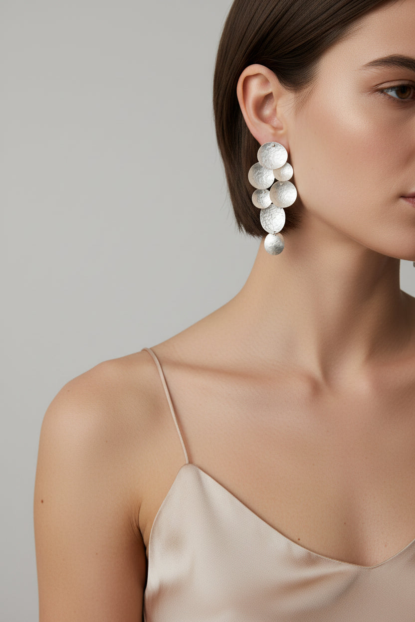 Cascade Sphere Earrings silver plated, worn on model with silk camisole, side profile