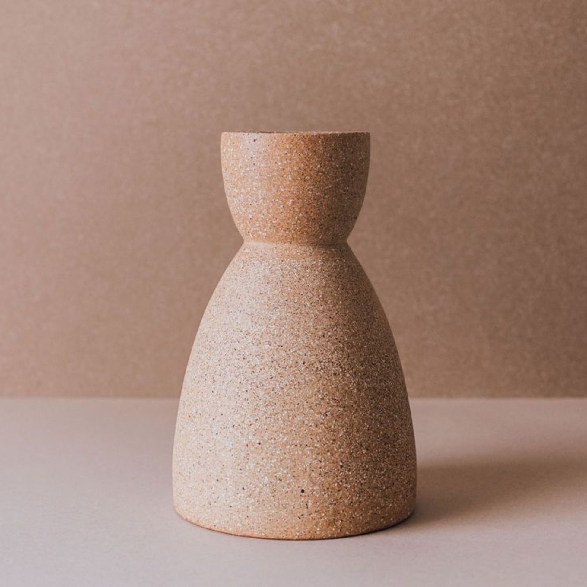 Cork clock ceramic vase in warm terracotta with sculptural hourglass silhouette