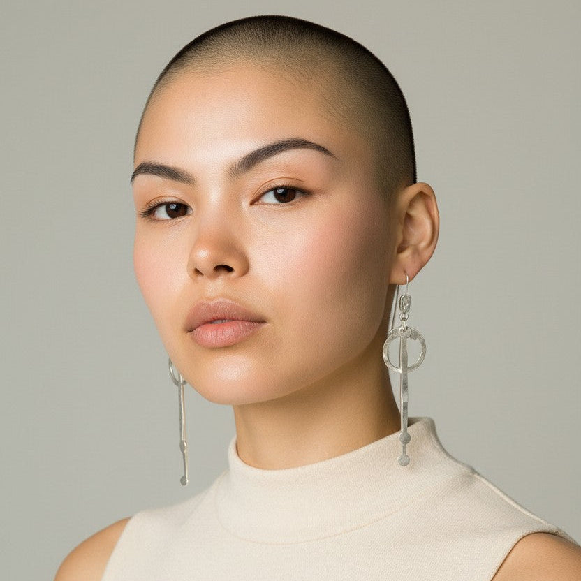 Long hammered dangle earrings with circle and bar design, handcrafted bronze base with gold or silver plating, lightweight artisan jewelry.