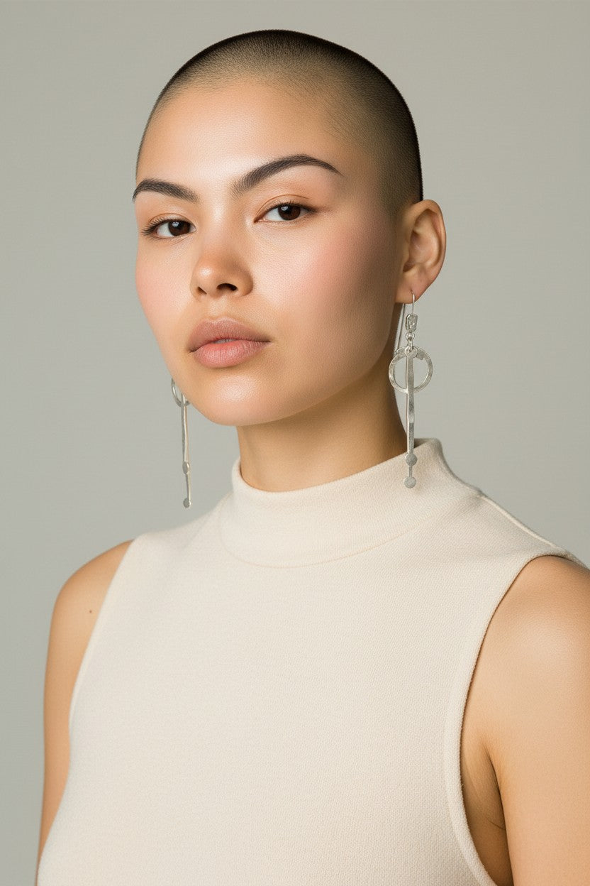Long hammered dangle earrings with circle and bar design, handcrafted bronze base with gold or silver plating, lightweight artisan jewelry.