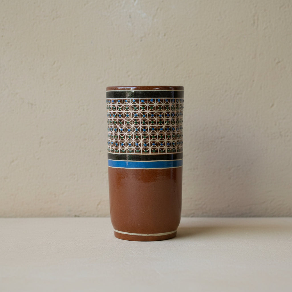 Hand-painted Tonalá petatillo ceramic tumbler on neutral background