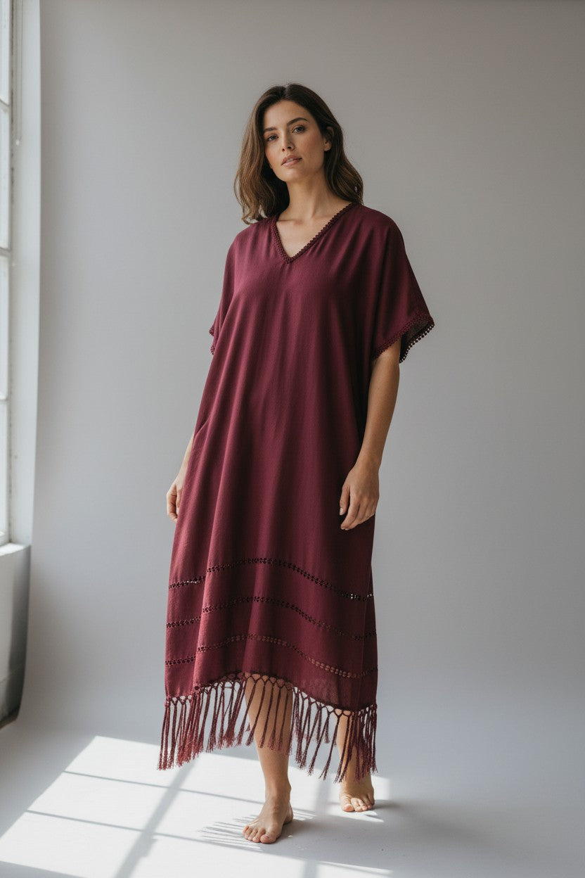 Handwoven silk blend kaftan dress in burgundy with V-neck and relaxed fit, studio side view with natural light