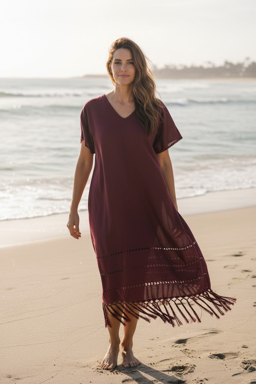 Burgundy handwoven silk blend kaftan dress on beach setting, breathable fabric and flowing drape