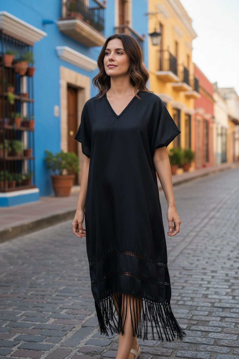 Black handwoven silk blend kaftan dress with fringe hem, street style view highlighting artisan craftsmanship