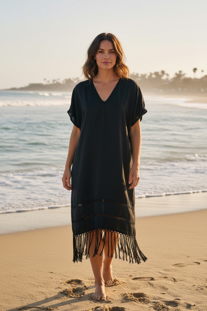 Black handwoven silk blend kaftan dress worn on the beach, lightweight fringe hem and relaxed silhouette