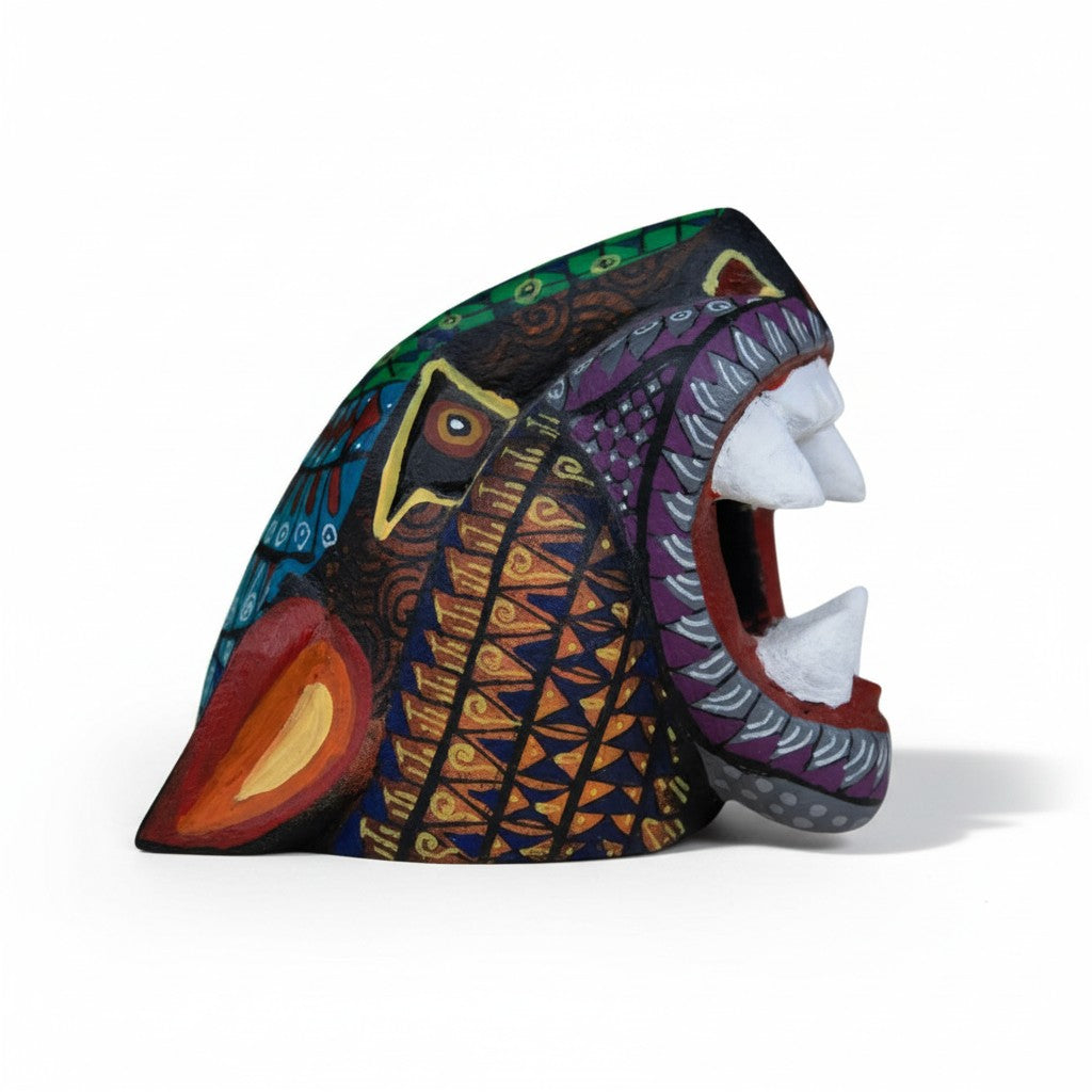 Oaxacan folk art jaguar alebrije hand-painted with vibrant geometric designs