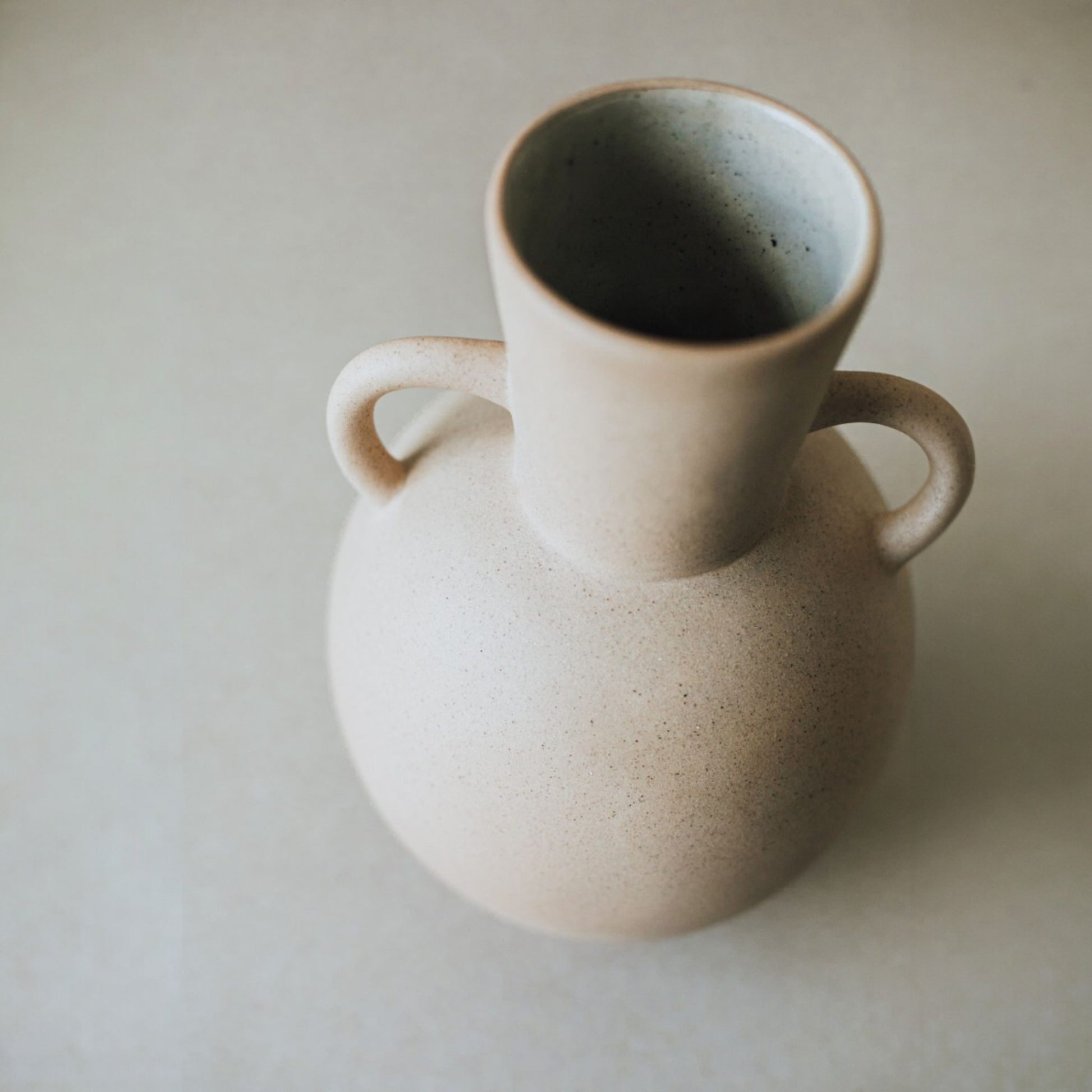 Glazed interior of sand clay urn vase
