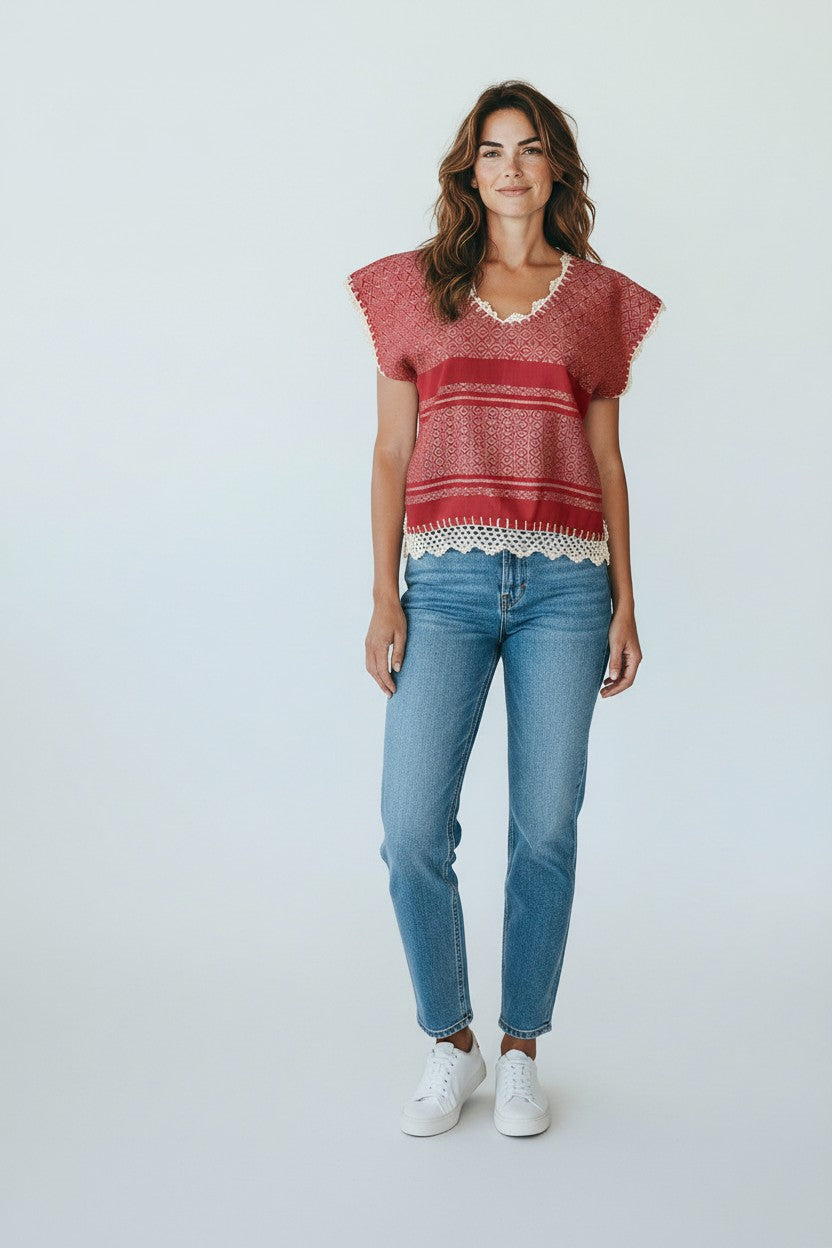Oaxaca handwoven cotton huipil top in coral red worn by model, studio full-body shot