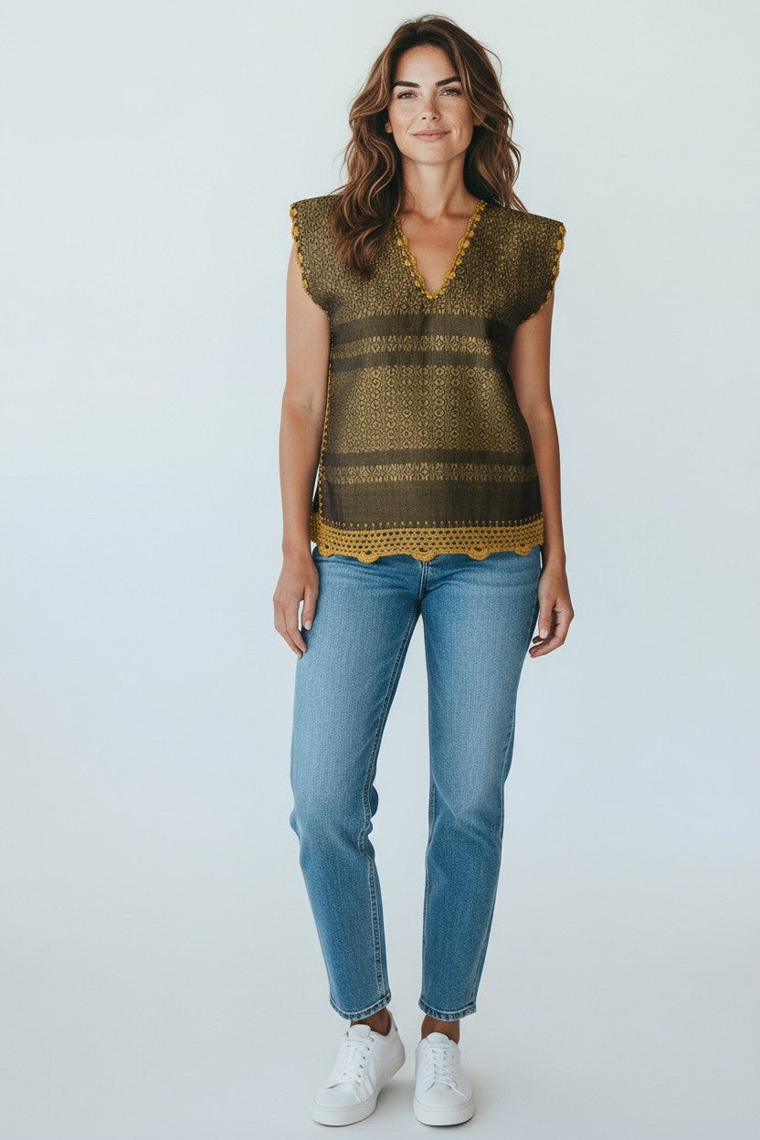 Oaxaca handwoven cotton huipil top in golden ochre worn by model, studio full-body shot
