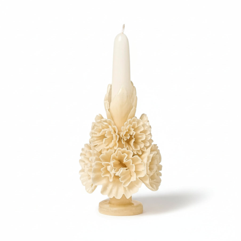 Ivory carved beeswax floral candle on a white background, handcrafted sculptural candle from Oaxaca